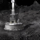Concept image showing the OSIRIS-REx sampler head on the surface of Bennu.